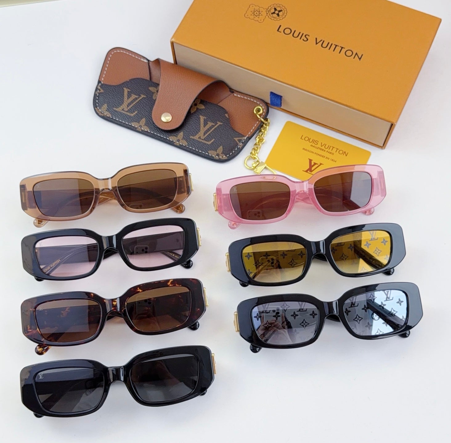 Louis Vuitton sunglasses set with multiple frames and monogram cases