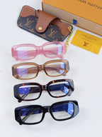 Assorted Louis Vuitton eyeglasses: pink, brown, dark tortoise, and navy frames with cases