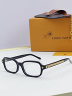 Louis Vuitton glasses with dark blue frames and gold side logo detailing