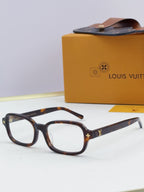 Louis Vuitton glasses with tortoiseshell frames and gold side logo detailing