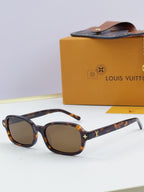 Louis Vuitton glasses with tortoiseshell oval frames and gold logo accents