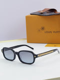 Louis Vuitton glasses with dark blue round frames and gold logo accents