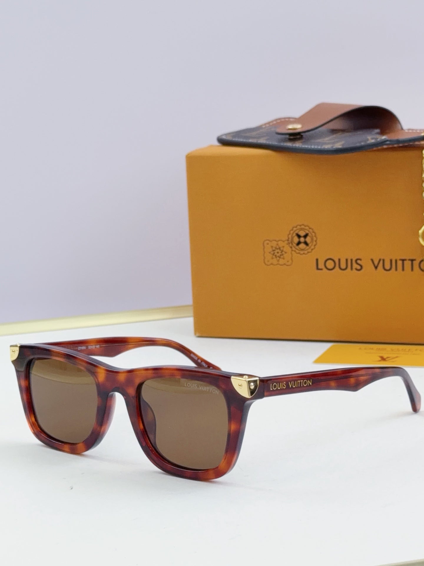 Louis Vuitton sunglasses with tortoiseshell frames and brown tinted lenses