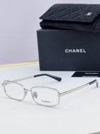Clear Chanel glasses with light gray lenses and thin metal temple arms