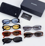 Chanel sunglasses assortment with mixed frame colors and tinted lenses, shown together.