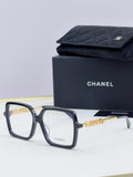 Chanel eyeglass frames, dark navy square acetate with gold logo detail, with black case
