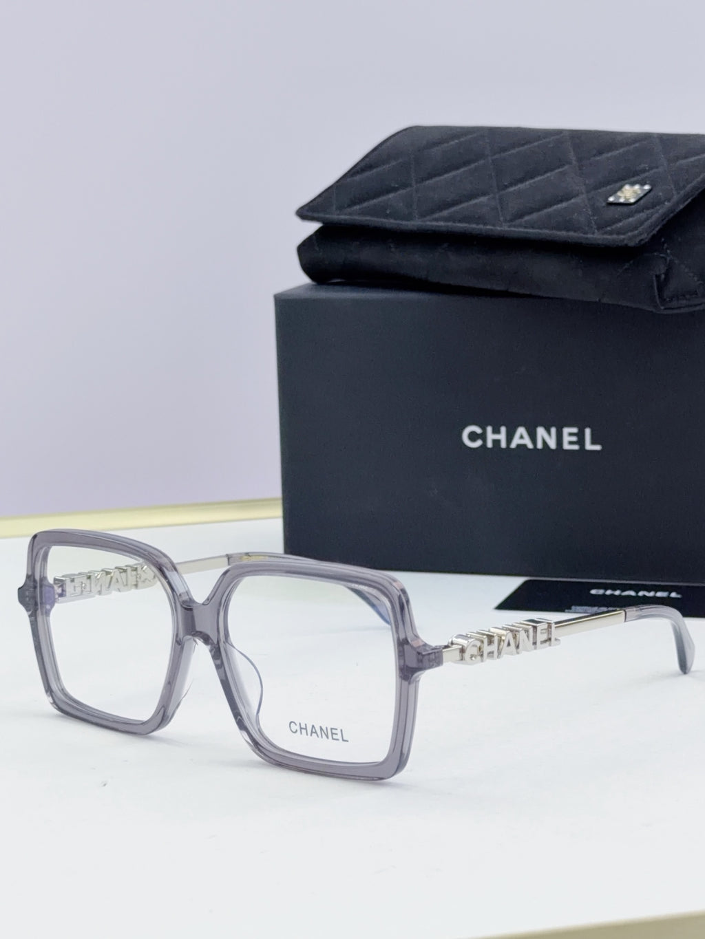 Chanel eyeglass frames, gray square acetate with gold logo detail, with black case