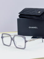 Chanel eyeglass frames, gray square acetate with gold logo detail, with black case