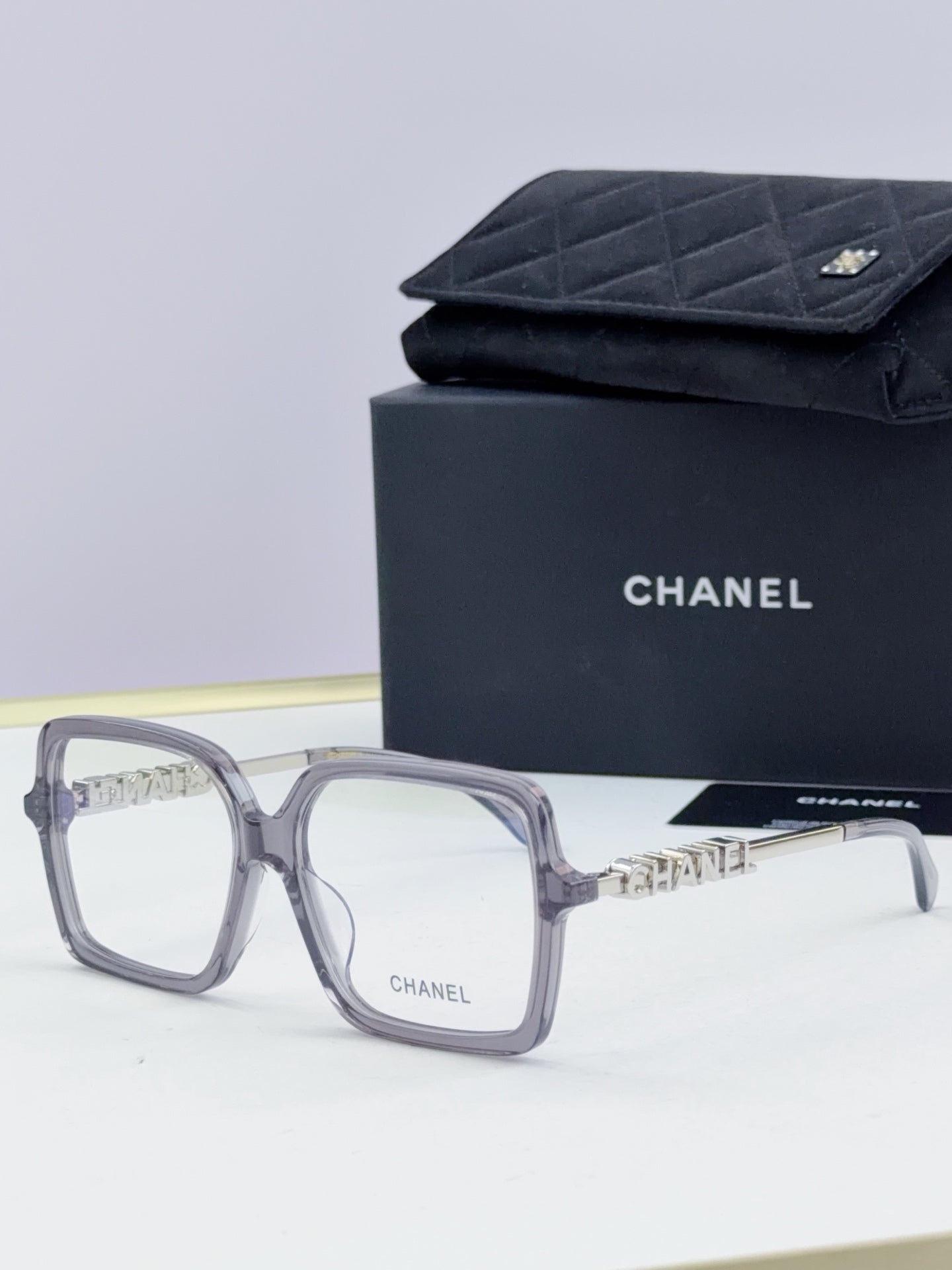 Chanel eyeglass frames, gray square acetate with gold logo detail, with black case