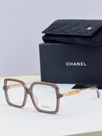 Chanel eyeglass frames, light brown square acetate with gold logo detail, with black case