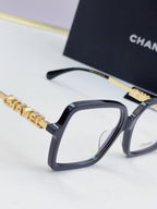 Chanel eyeglass frames, black square acetate with gold logo temple detail