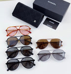 Chanel sunglasses assortment with colored frames and a black storage case.