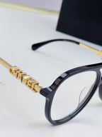 Chanel optical glasses, black frame with gold chain bar detailing at temples