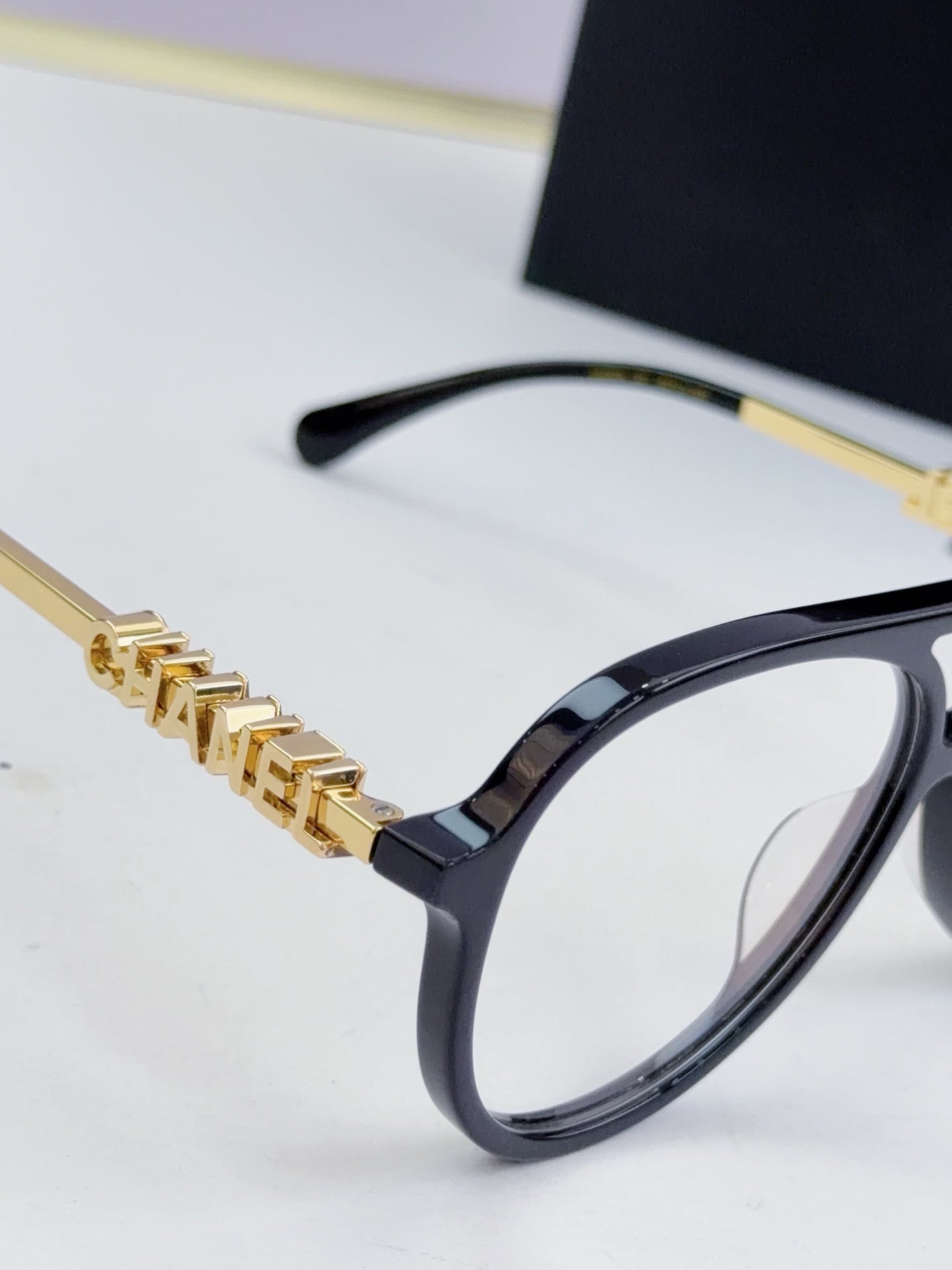 Chanel optical glasses, black frame with gold chain bar detailing at temples