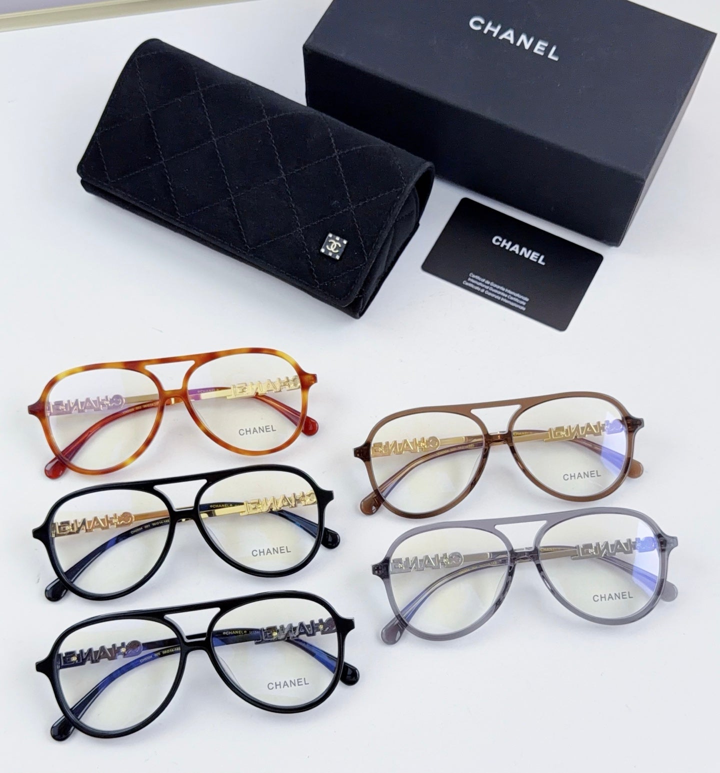 Set of Chanel optical glasses in assorted colors with round frames and gold details
