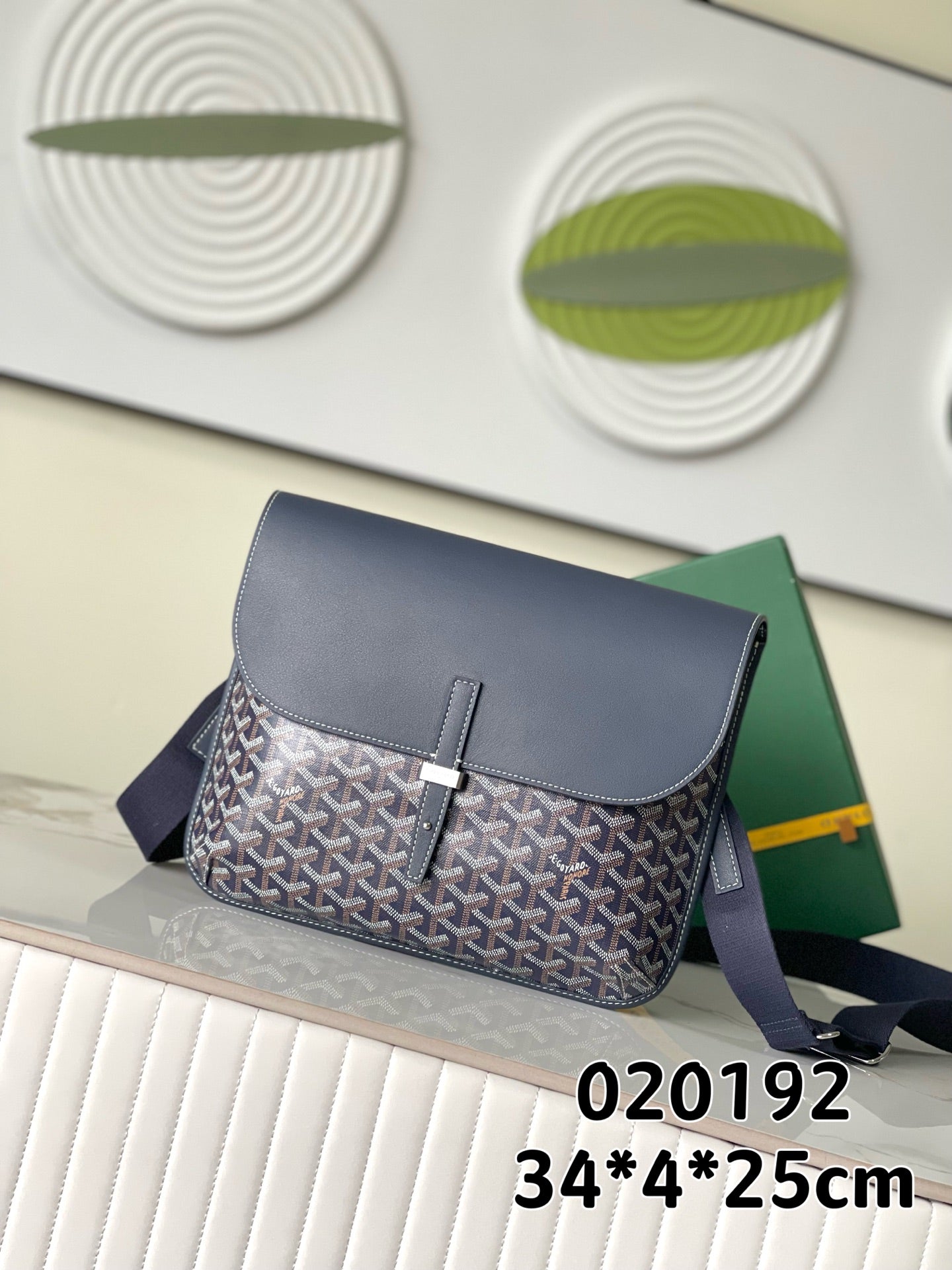 Navy patterned crossbody bag with flap and adjustable shoulder strap