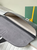 Goyard bag interior opening with gray lining and top flap edge
