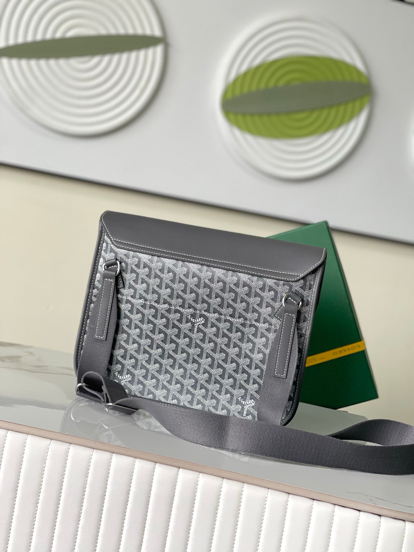 Goyard patterned satchel bag with gray flap and side pockets