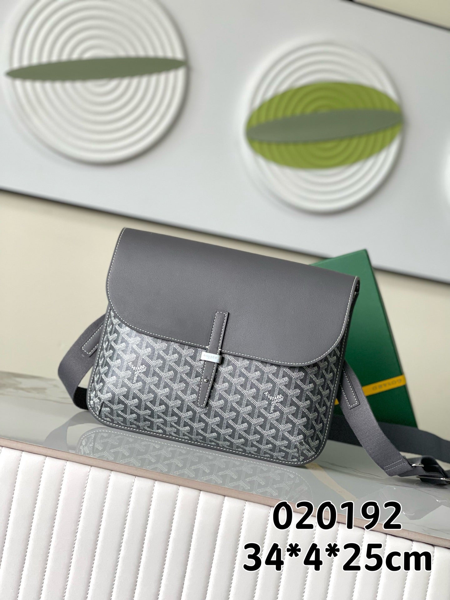 Goyard patterned shoulder bag with gray flap and adjustable crossbody strap