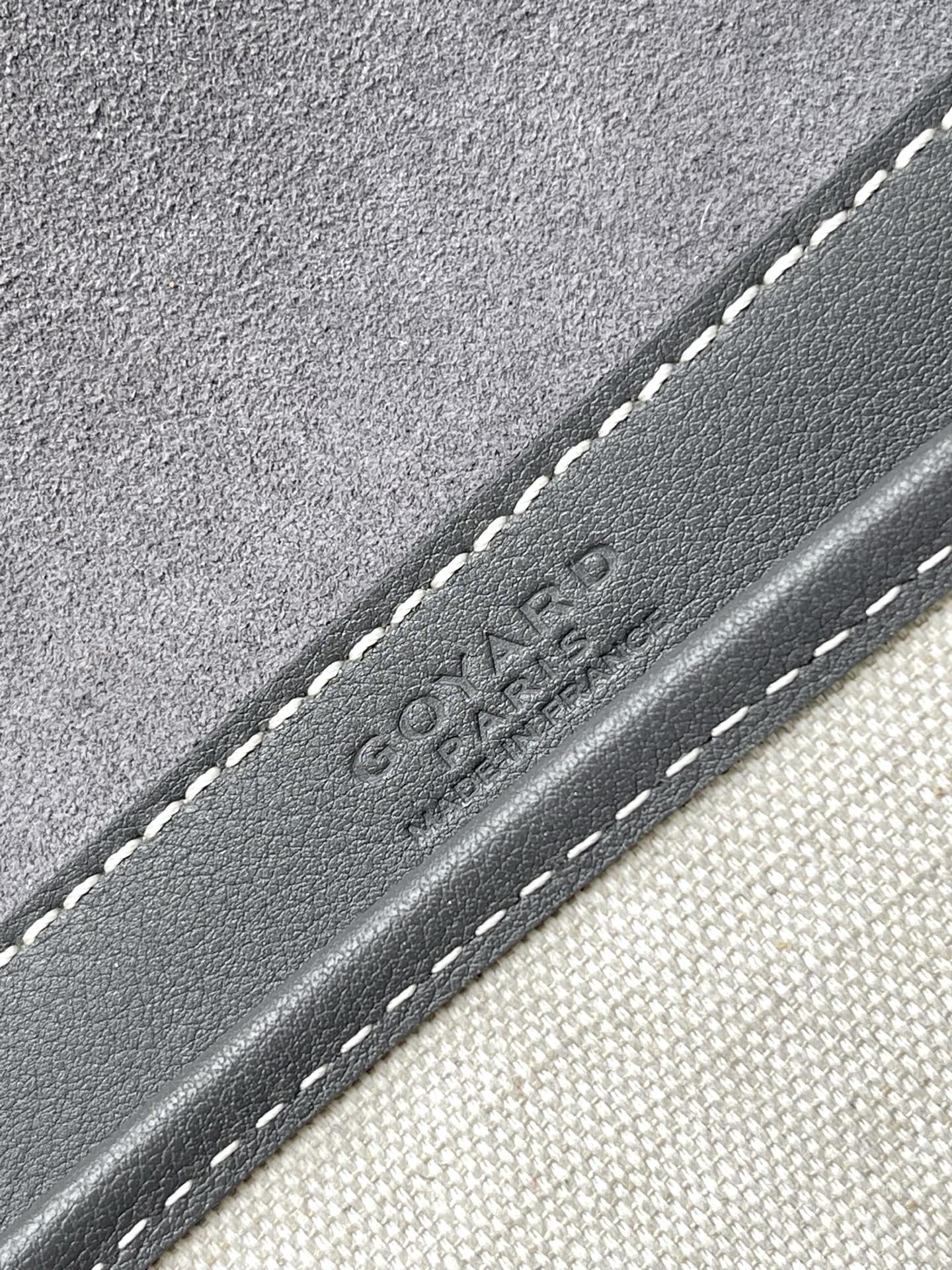 Goyard embossed logo on gray leather trim with contrast stitching