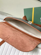 Open brown suede-lined bag with leather top flap and interior side pocket