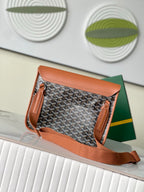 Patterned handbag with tan flap and leather trim, open top view