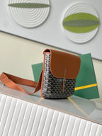 Mini patterned crossbody bag with tan top flap, side pocket, and shoulder strap