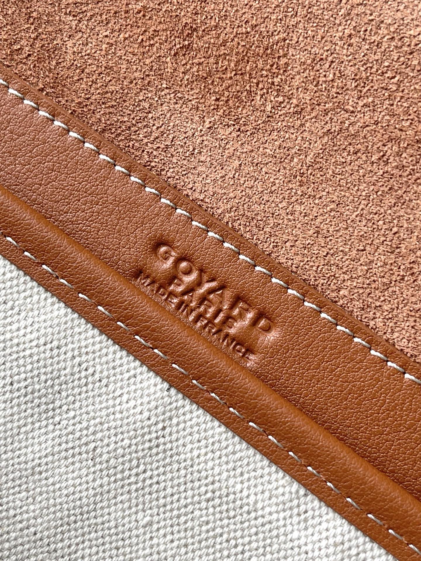 Tan leather trim with stitched edge and stamped GOYARD lettering