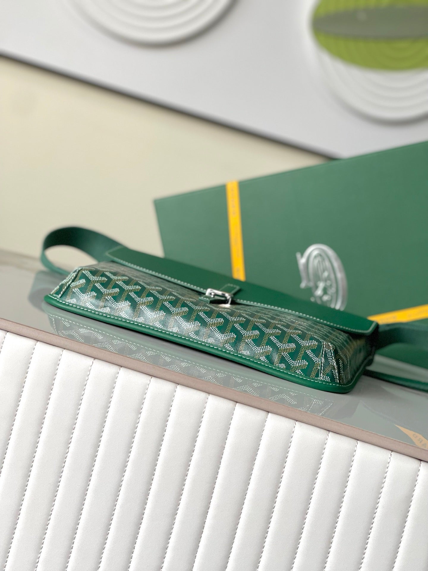 Goyard green monogram crossbody bag with zipper top and strap