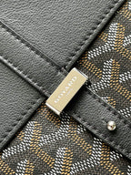Goyard logo plaque on dark leather strap with patterned canvas