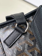 Goyard patterned canvas bag with dark leather loop and metal ring