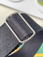 Goyard adjustable strap with silver-tone buckle on textured fabric