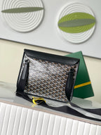 Goyard handbag open, showing patterned lining and zippered side pockets