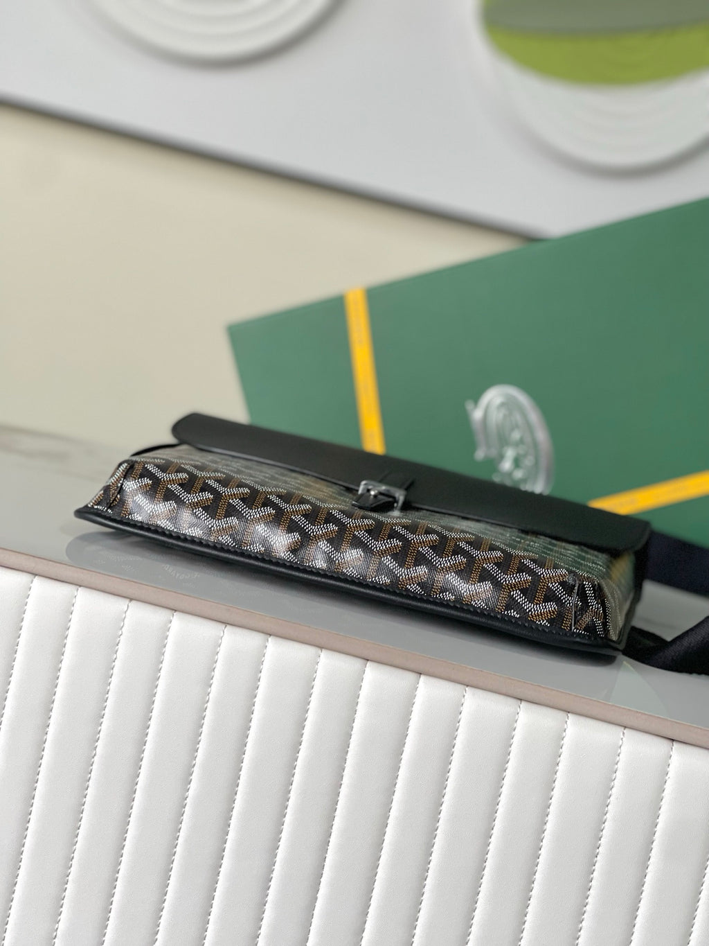 Goyard mini bag with top flap and monogram canvas body, black leather trim