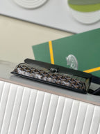 Goyard mini bag with top flap and monogram canvas body, black leather trim