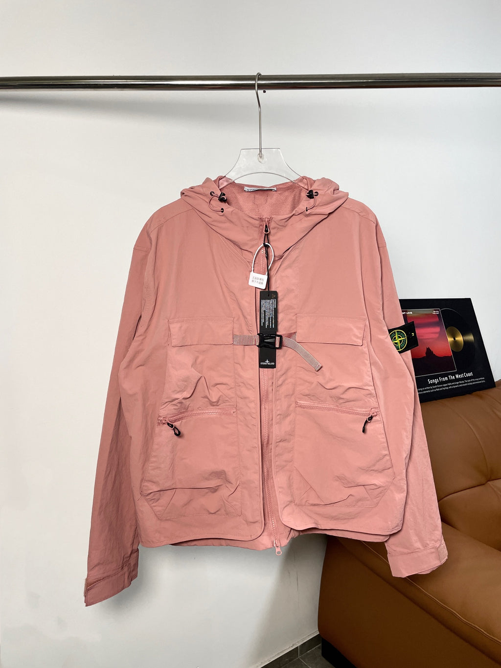 Pink Stone Island hooded zip jacket with drawstrings and front pockets