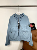 Blue Stone Island hooded zip jacket with drawstrings and front pockets