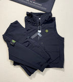 Dark navy Stone Island hooded zip vest with multiple pockets and logo patch