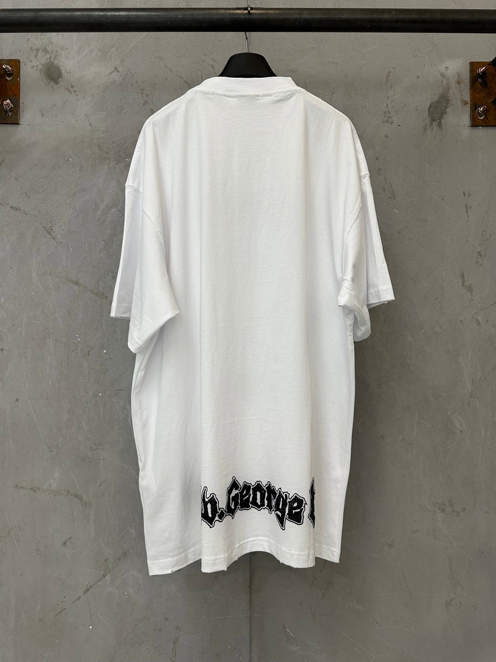White graphic T-shirt with crew neck and short sleeves, back view
