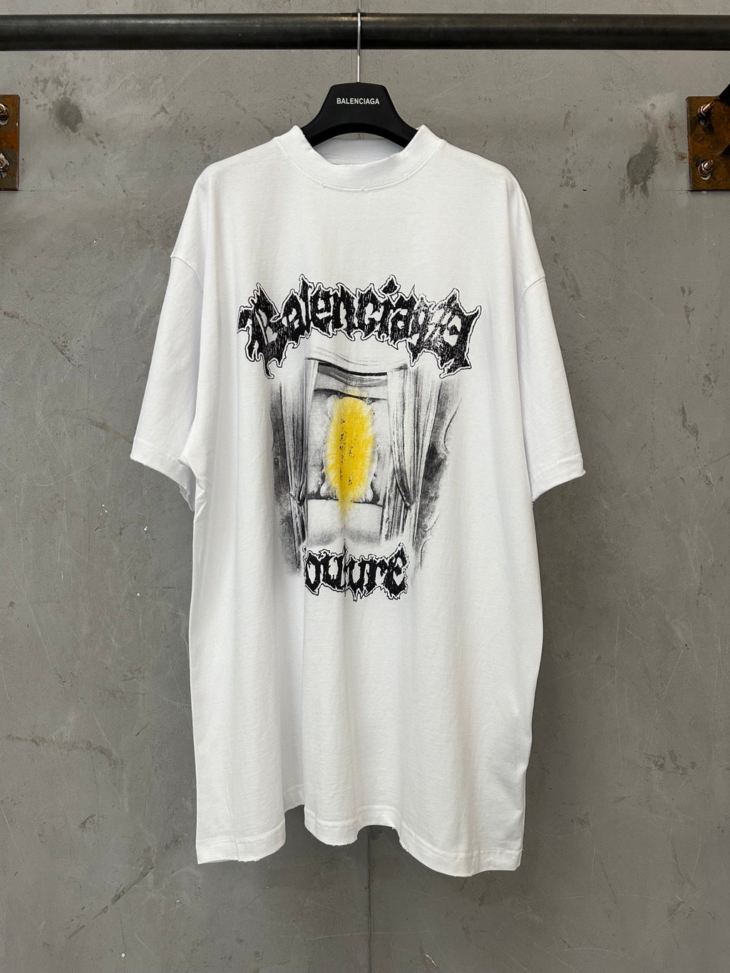 Balenciaga white graphic T-shirt with front drum-style print and yellow accent