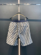 Dior pants straight-on view with navy elastic waistband and repeating FF print