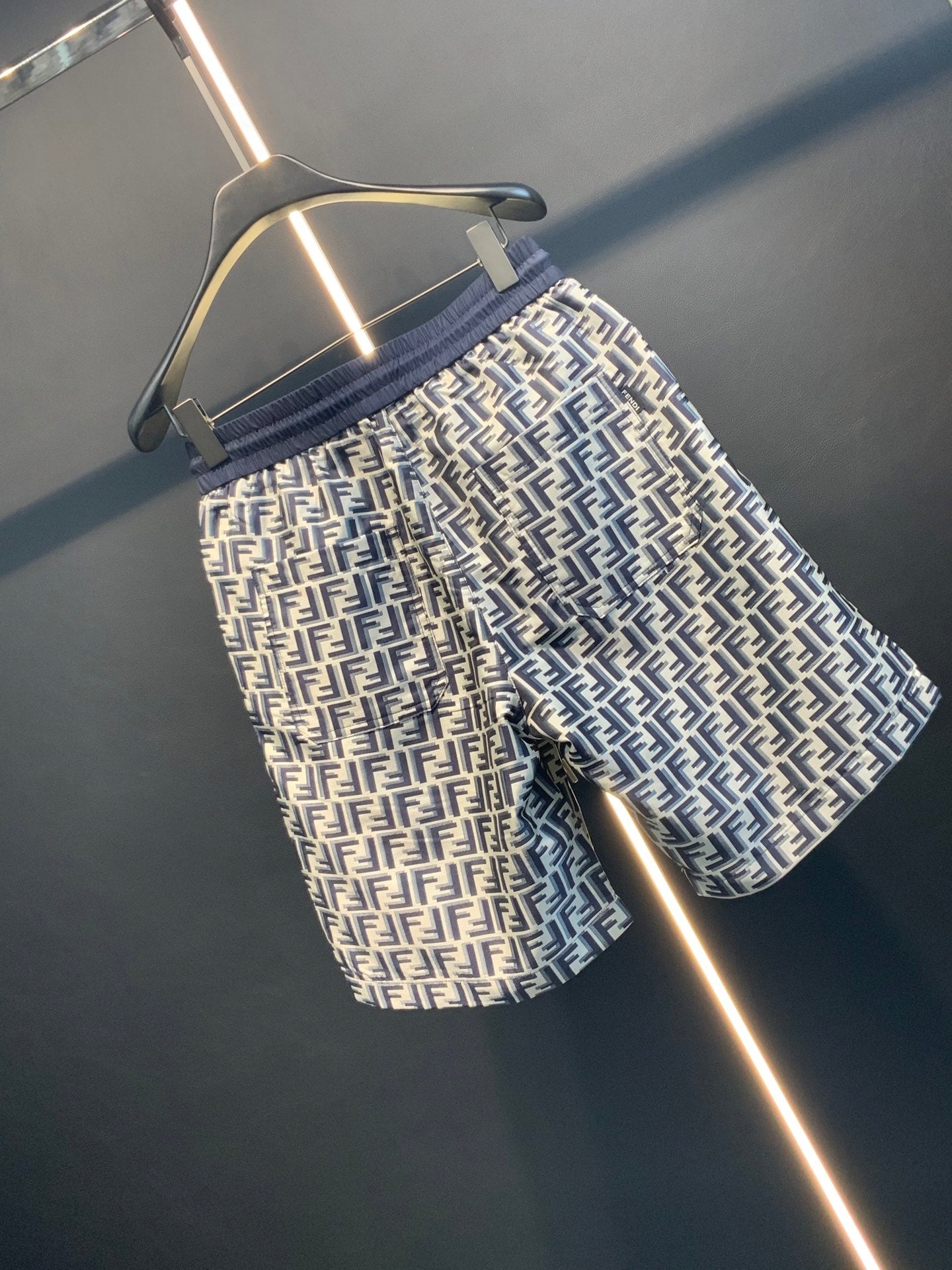 Dior pants close angle with navy elastic waistband and FF monogram print