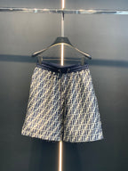 Dior pants front view with navy elastic waistband and repeating FF print