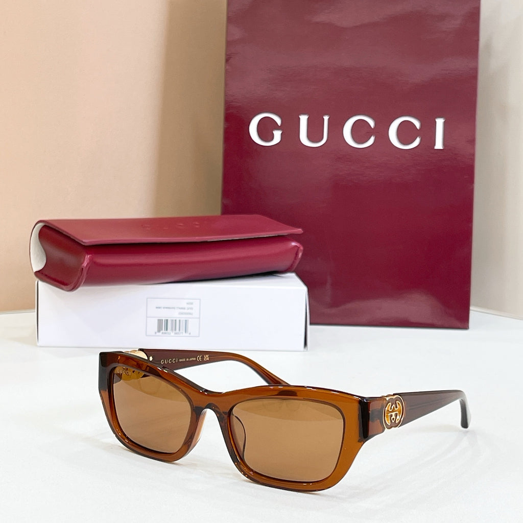 Tortoiseshell rectangular sunglasses with amber lenses and gold logo detail