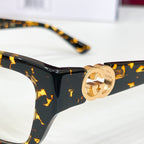Gucci eyeglasses temple, black with gold interlocking GG emblem