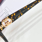 Gucci eyeglasses temple, black with gold GG emblem and text