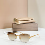 Gold-tone sunglasses with amber tinted lenses and thin rectangular frames