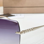 Bvlgari sunglass temple with gold-tone engraved detail and metal hinge