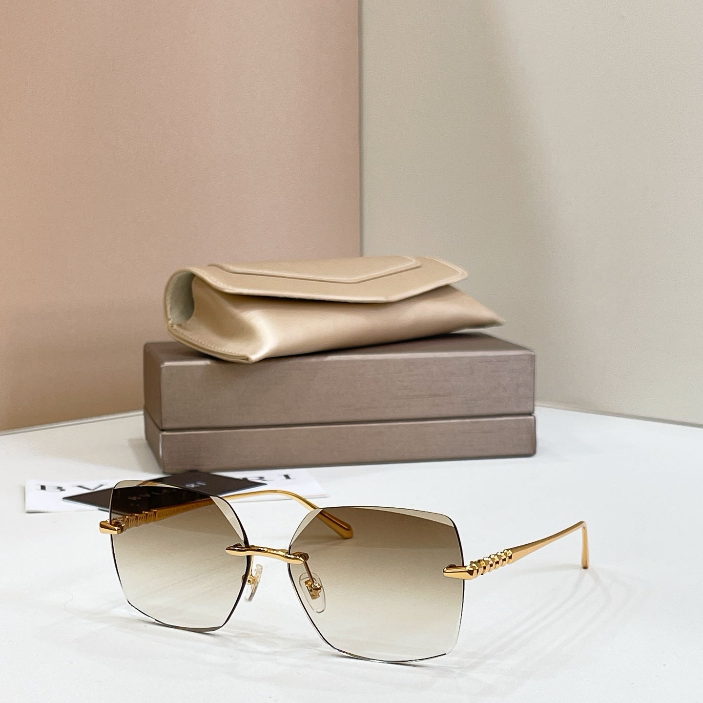Bvlgari clear-lens square sunglasses with gold-tone metal frame and thin temples