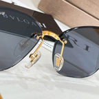 Gold-tone sunglasses with dark lenses and Bvlgari logo on lens rim